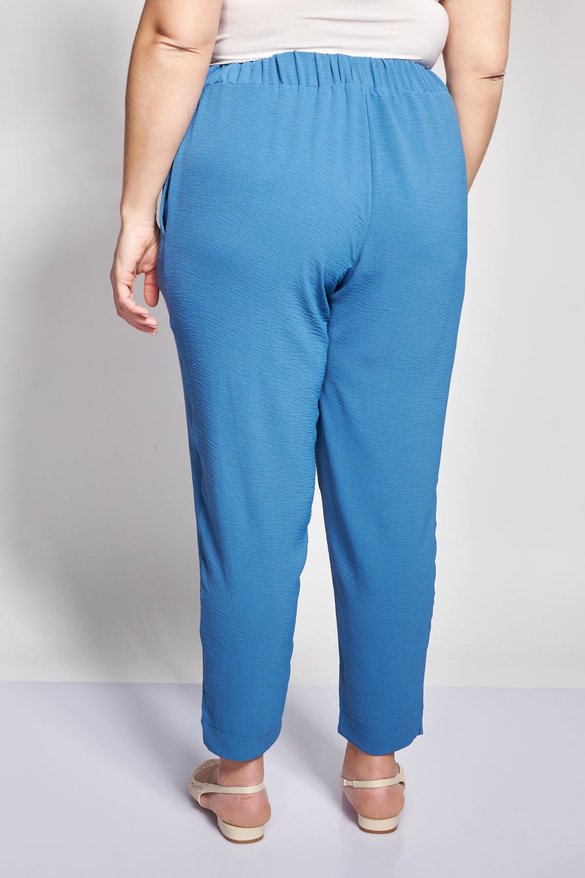 Tapered trousers with turn-ups in textured washed - Indigo